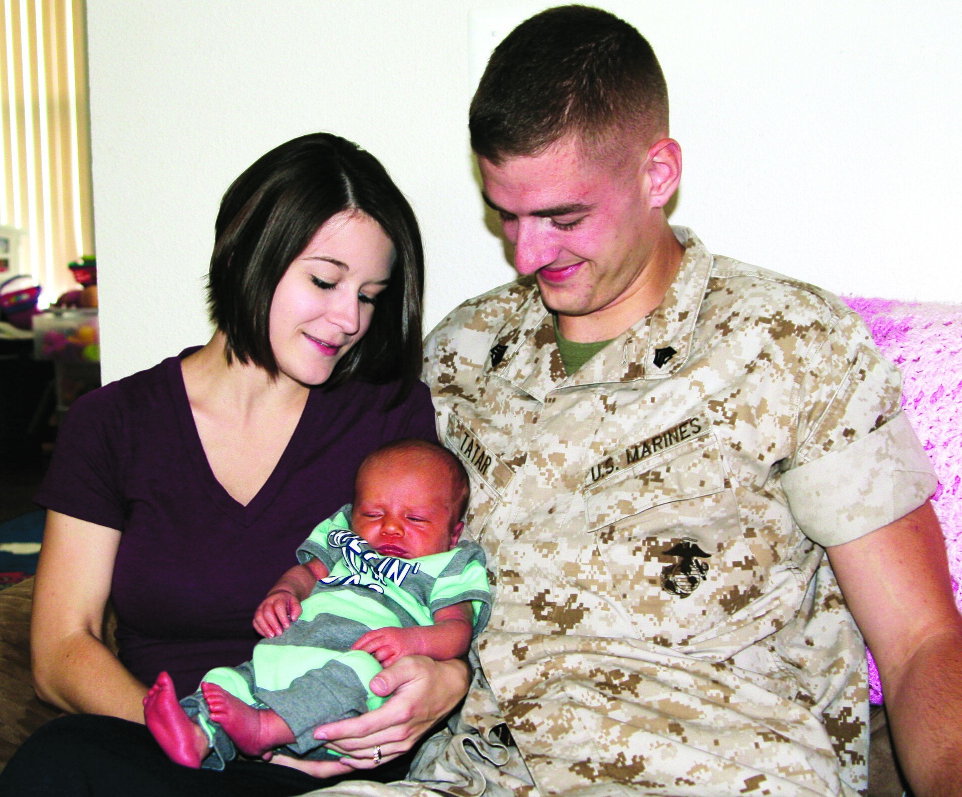 Parent with newborn representing family leave policies